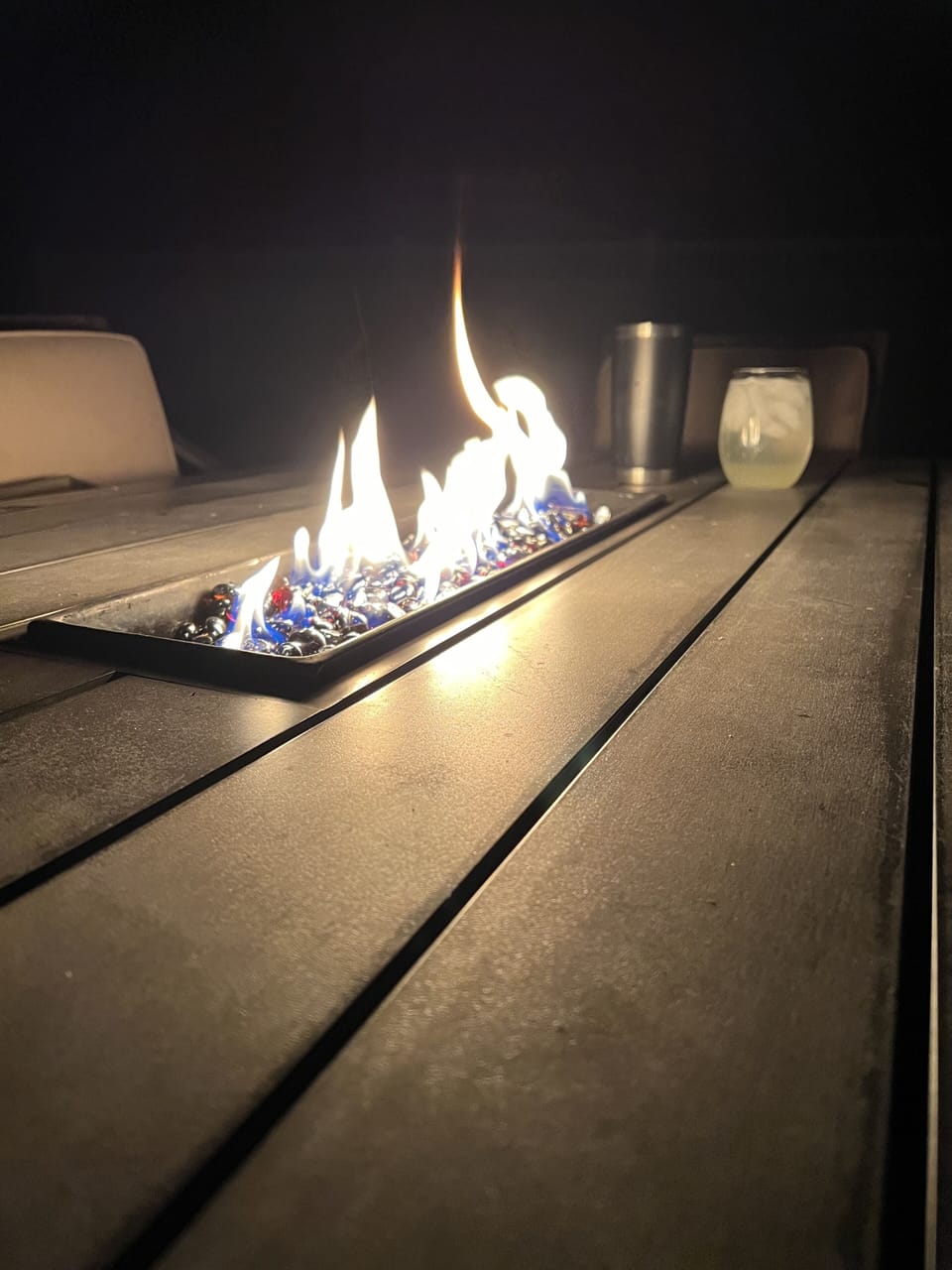 The fire table provides a great setting to enjoy a beverage a conversation