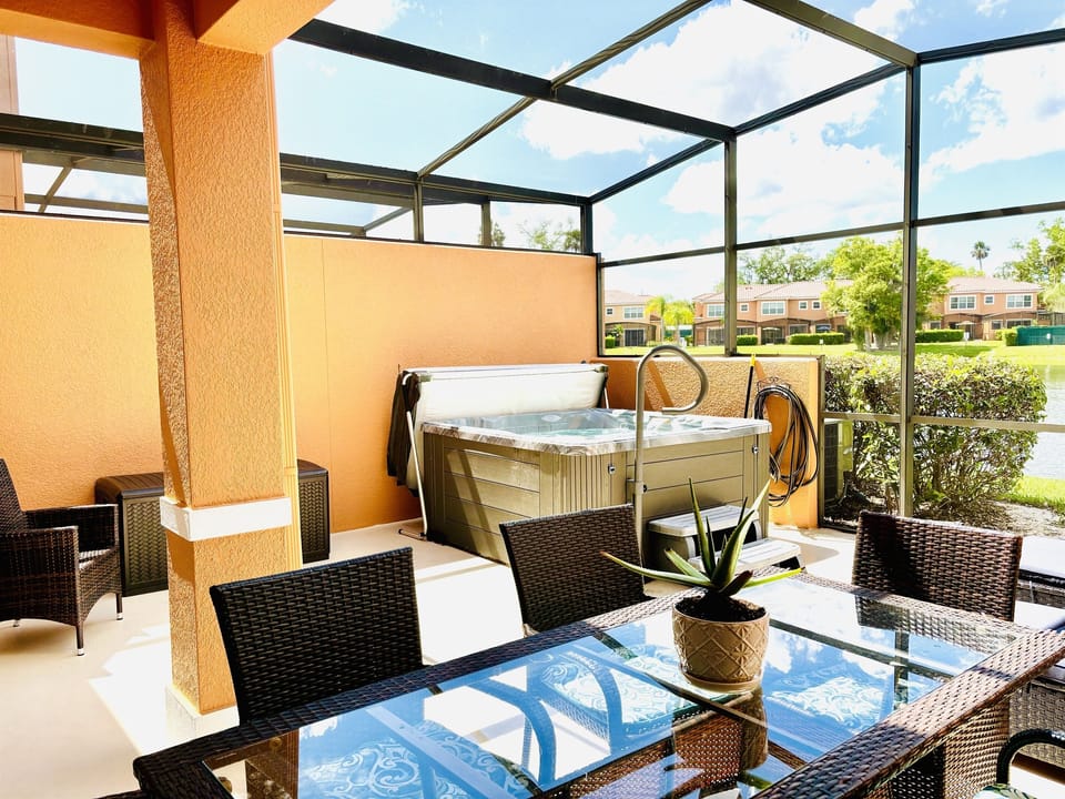 Private lanai with hot tub, seating area and dining area