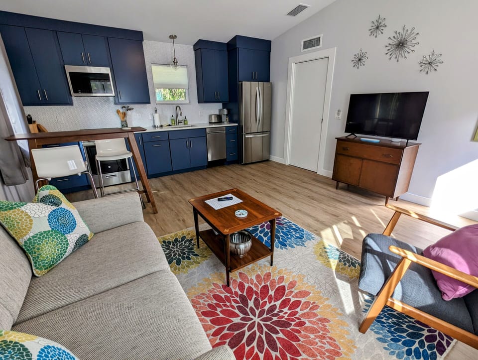Living, dining, and kitchen areas