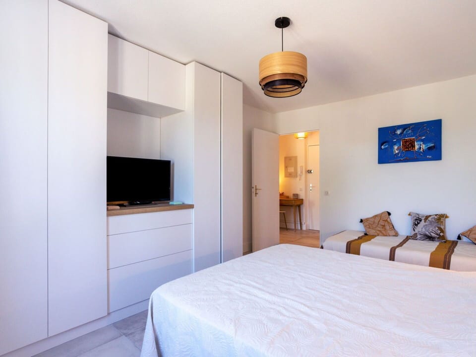 Furniture, Building, Property, Cabinetry, Comfort, Television, Wood, Bed, Lamp, Lighting