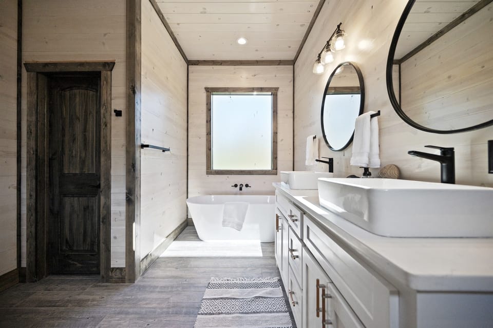 Spa-Like Bath Oasis: Indulge in a serene soak under natural light and modern touches!