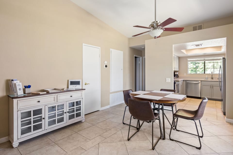 Dining table overlooking kitchen including information center