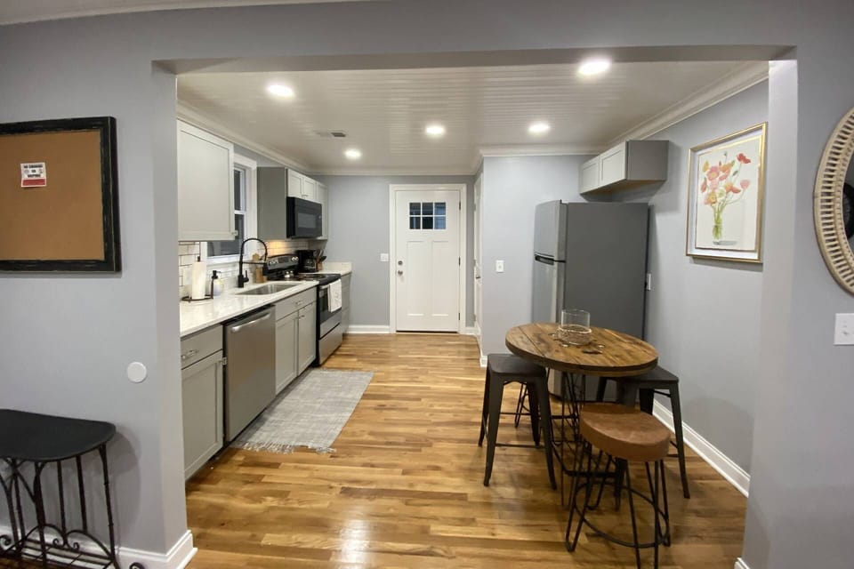 Fully stocked kitchen has ample dishes, glasses, silverware, bowls, pots and pans for quick food on the run or full meals.