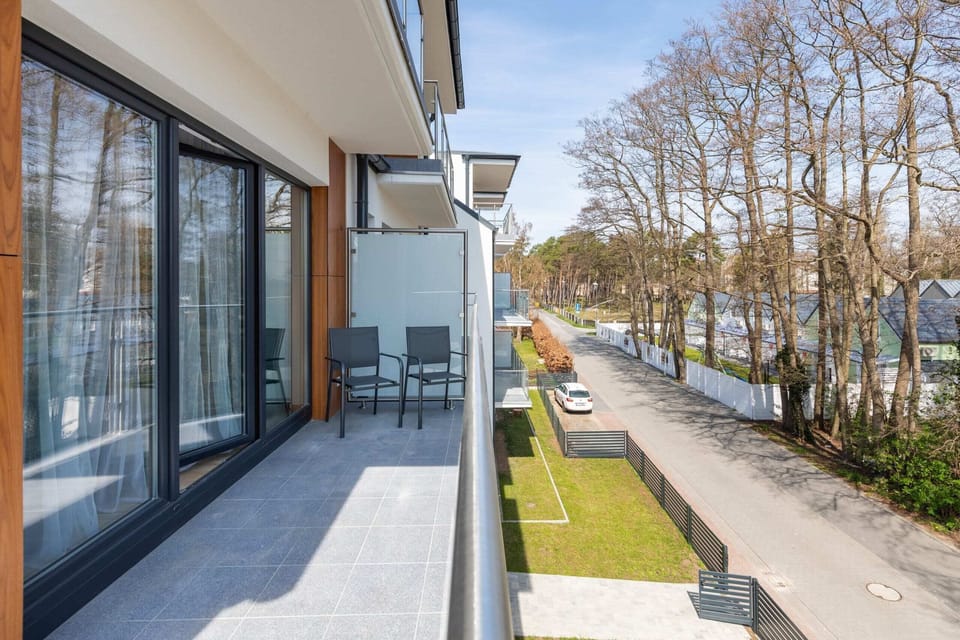 The balcony provides a perfect spot for enjoying the fresh air. 