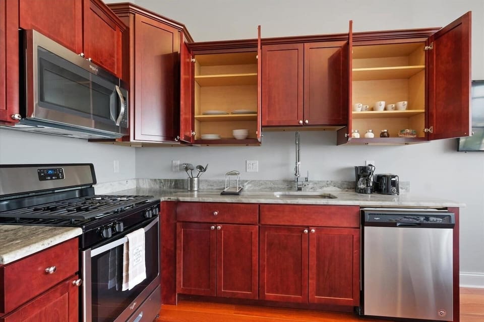 Kitchen workspace with stainless appliances and ample counter space keeping everything organized.