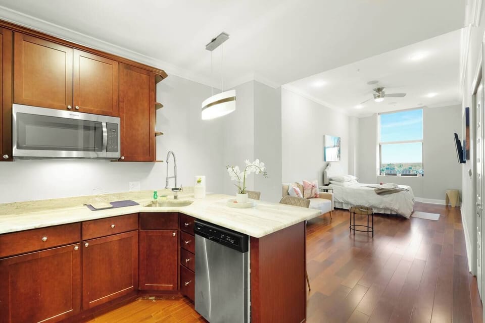 Kitchen and dining area with cherry cabinetry and open layout offering functional living space.