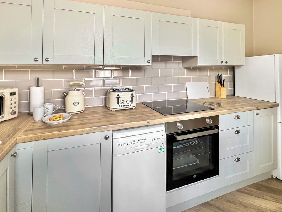 Kitchen | Sunset Cottage - Bron Y Wendon Holiday Park, Llanddulas, near Llandudno
