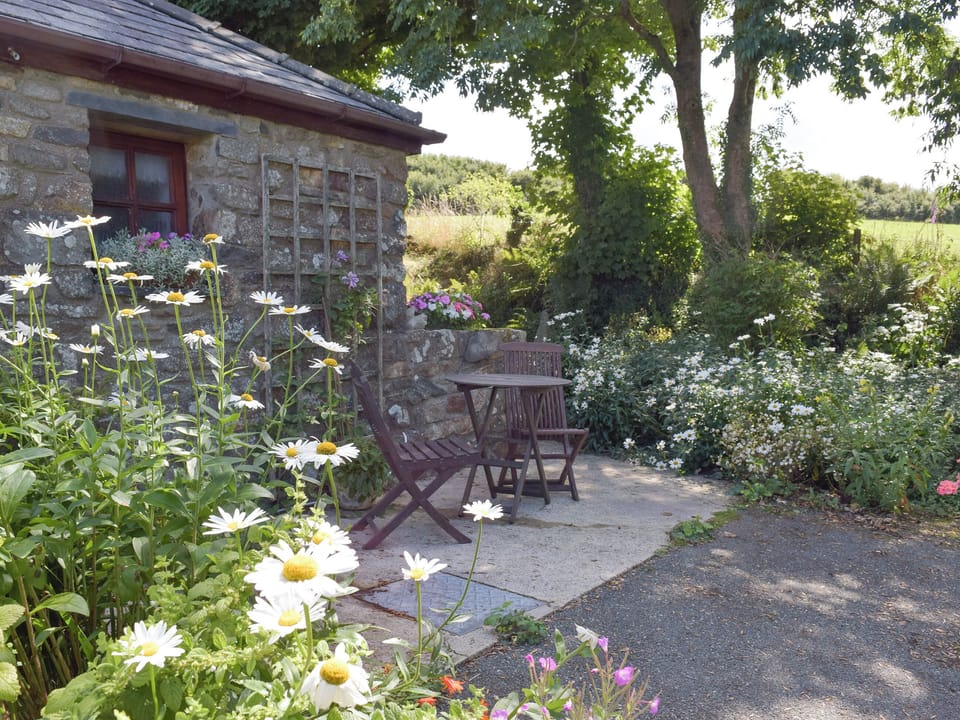 Paved patio with outdoor furniture | Yr Hen Efail, Fishguard