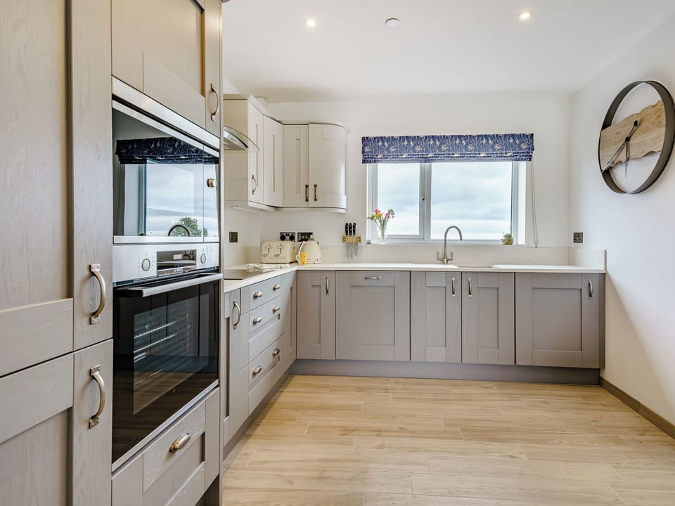Kitchen area | Willow Tree Cottage - Coastal View Cottages, Ludchurch, near Narberth