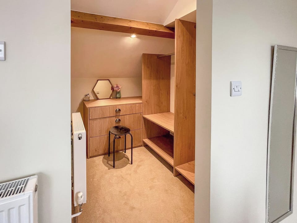 Dressing area of bedroom | Hambledon Cottage Holiday - The Old Pump House - Hambledon Cottage Holidays, Child Okeford, near Blandford Forum