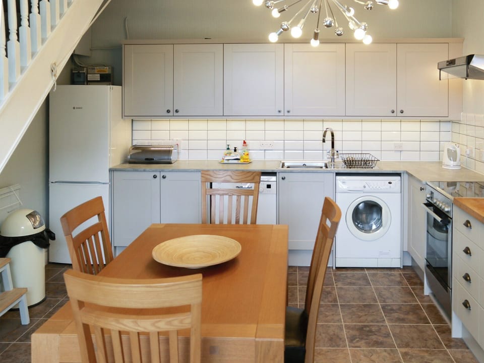Convenient dining area within kitchen | Winville Cottage, Askrigg