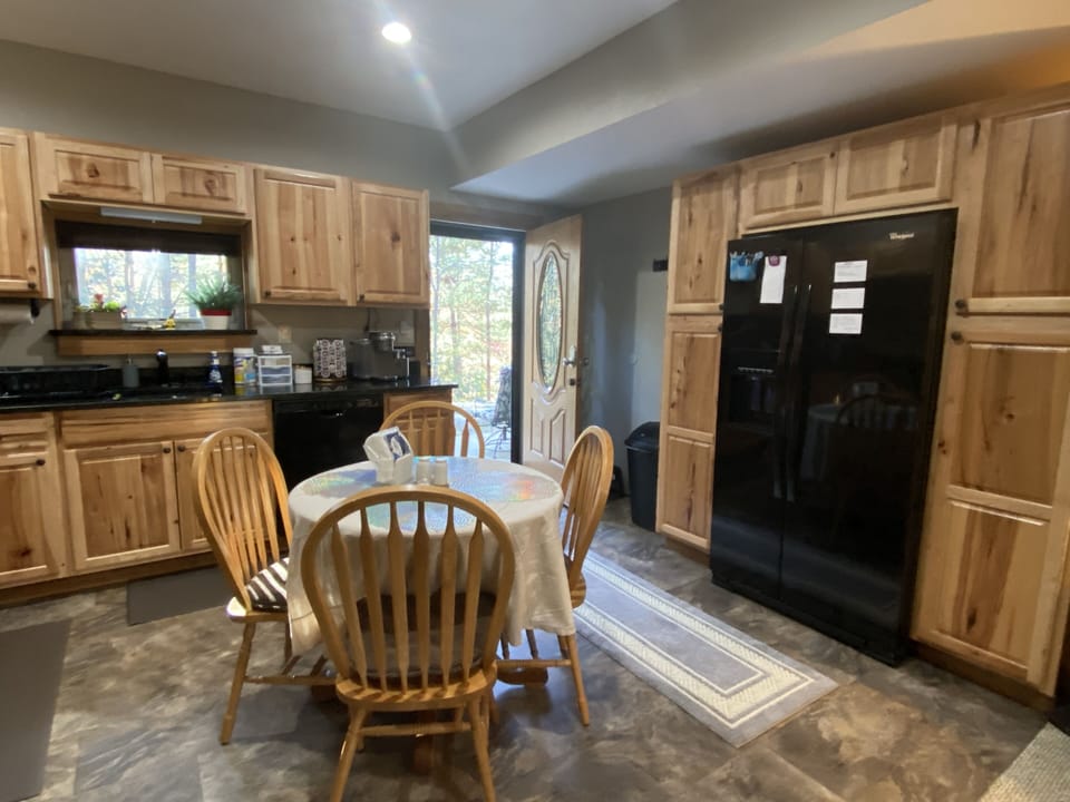 Kitchen, fridge, pantry, dining table and chairs 