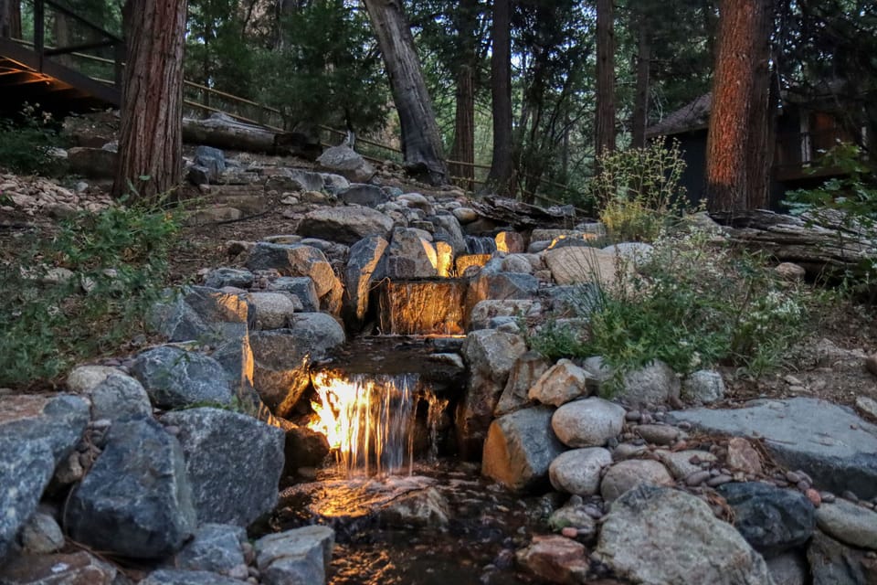 You will no doubt love the private backyard stream that is lit up at sundown.
