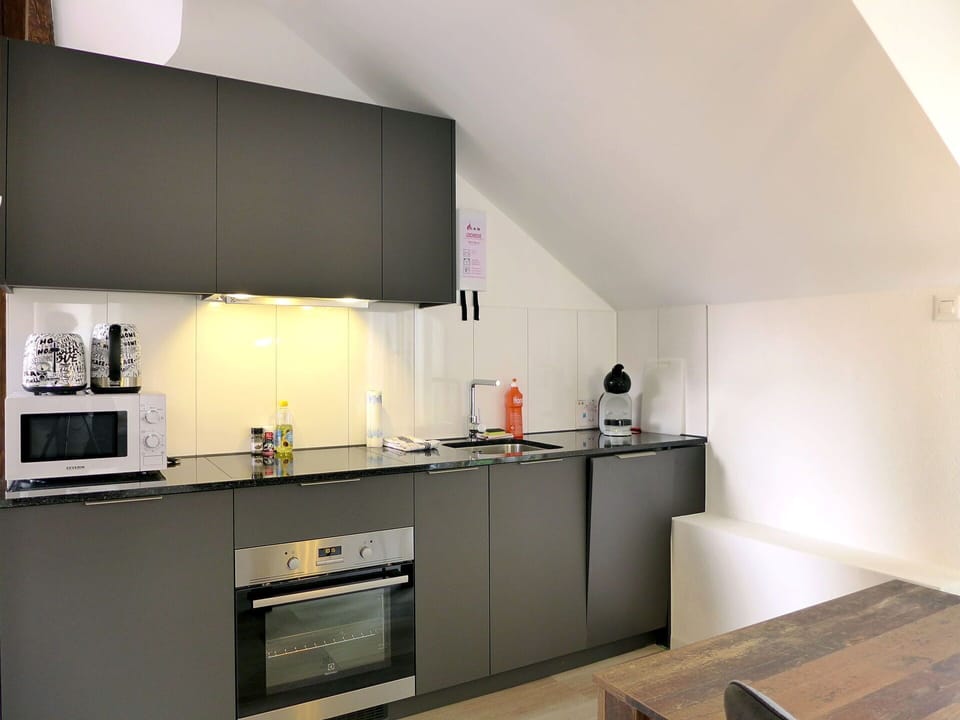 Cabinetry, Countertop, Building, Kitchen Stove, Kitchen, Wood, Interior Design, Drawer, Floor