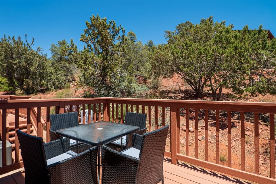 The back deck with dining table and BBQ grill