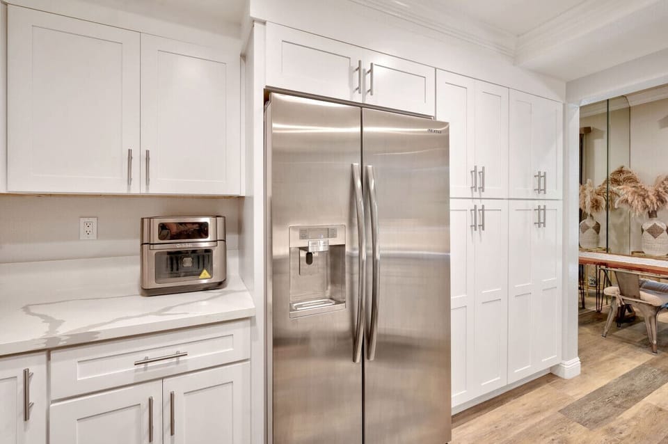 Kitchen with fully  equipped with dishes and pots & pans, toaster, etc.