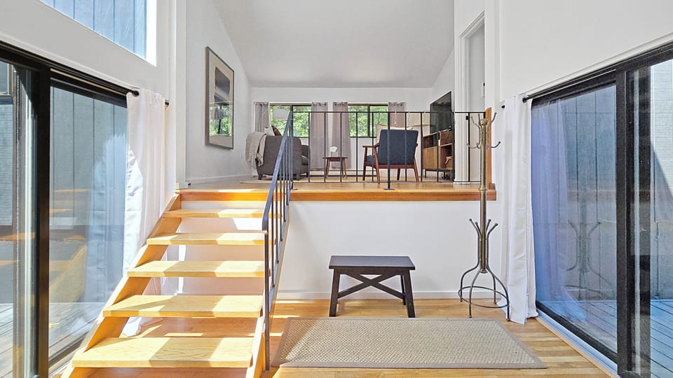 Steps lead to the living room and bedrooms