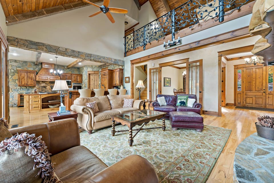 Main living room with TV for streaming and gas log fireplace