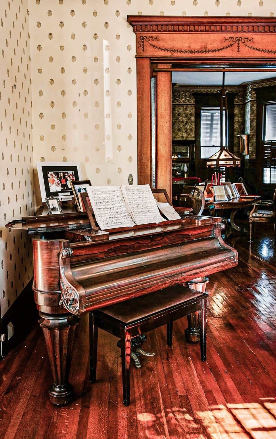 The vintage grand piano gives a glimpse into the past. Showcasing the unique history of the Curry Mansion and those who enjoyed their nights entertained in the foyer.
