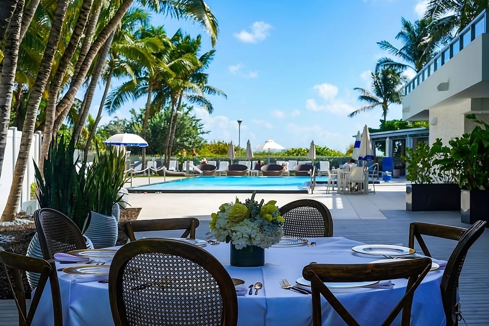 Savor poolside meals with palms, sunshine, and breezy comfort.