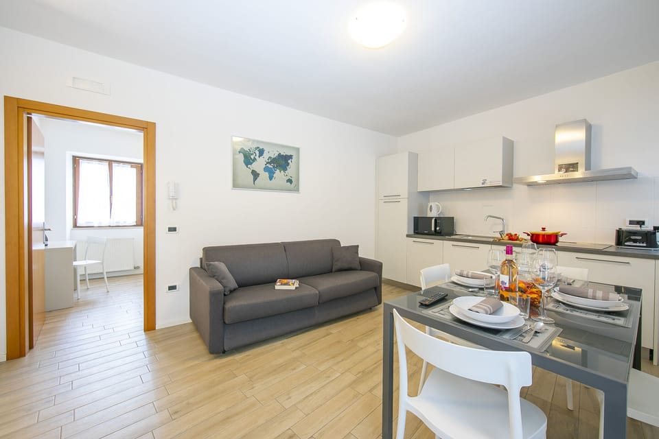 The living room with a three-seater sofa bed