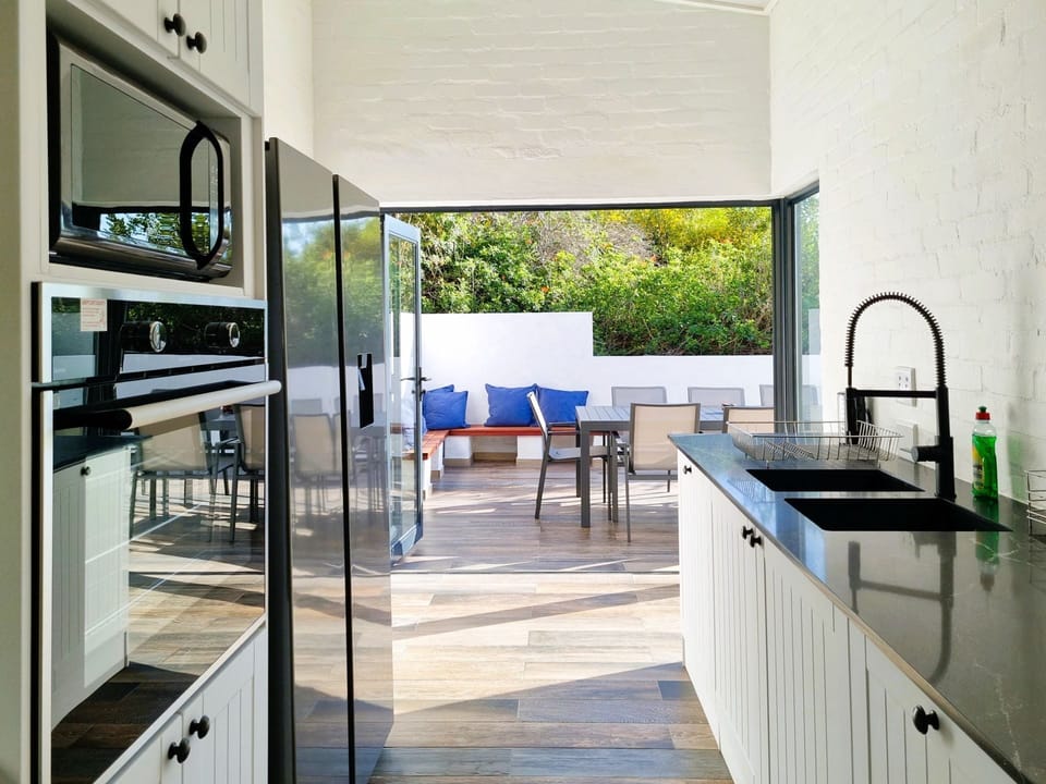 Kitchen area that has direct access to the outside patio. 