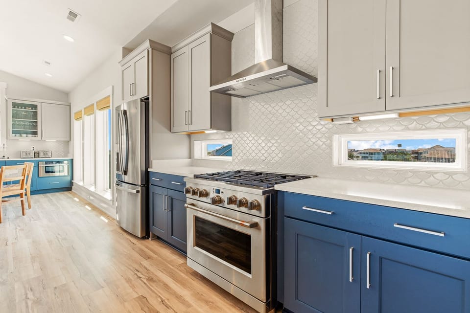 Kitchen with Bar Stool Seating on Third Level