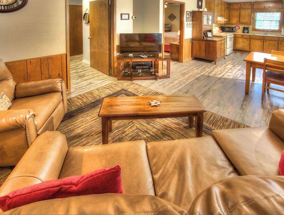 Open living area and covered deck on the river