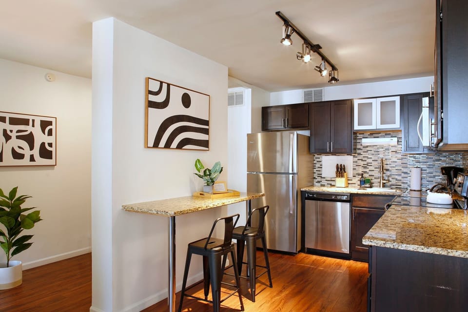 Spacious kitchen with granite countertops and stainless appliances