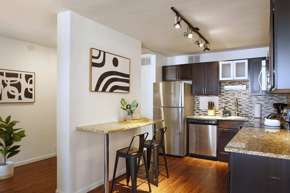 Spacious kitchen with granite countertops and stainless appliances