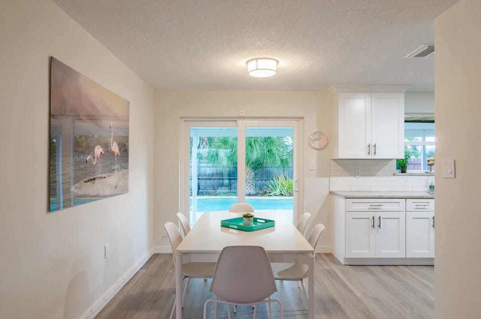 Dining room with doors to pool