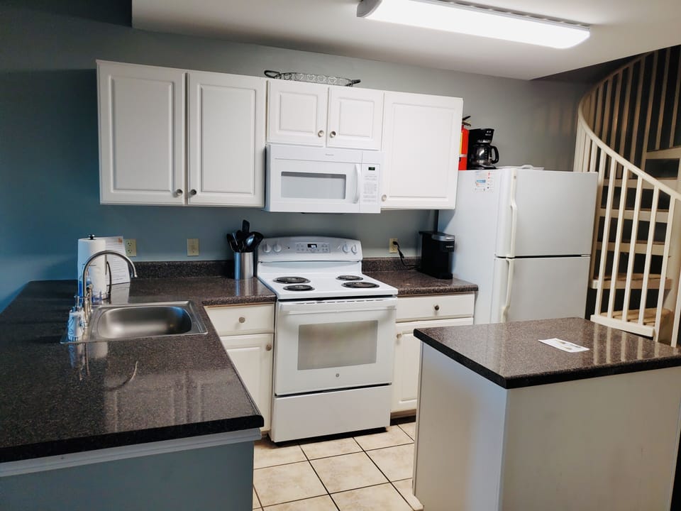 Kitchen with new stove and microwave