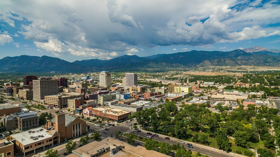Bustling downtown with mountain views beyond