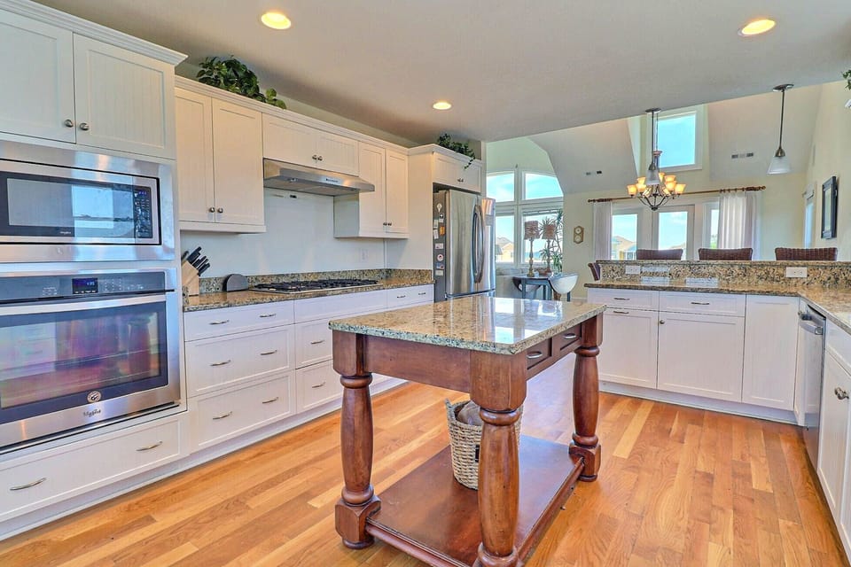 Two dishwashers and a miniature island make prep and cleanup for your family meal a breeze.