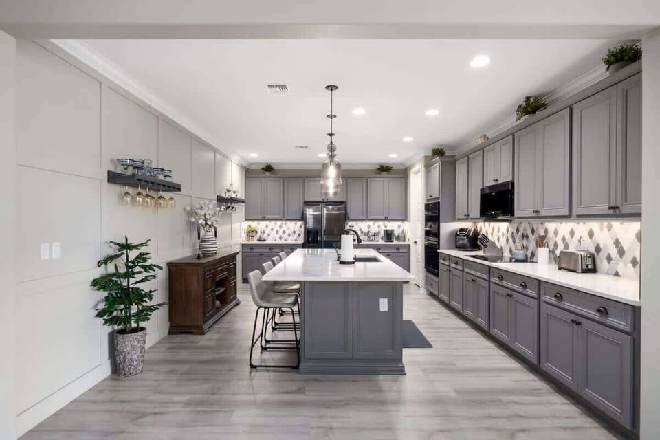 Get a complete look at our kitchen, showcasing its modern design and full range of appliances for all your cooking needs.
