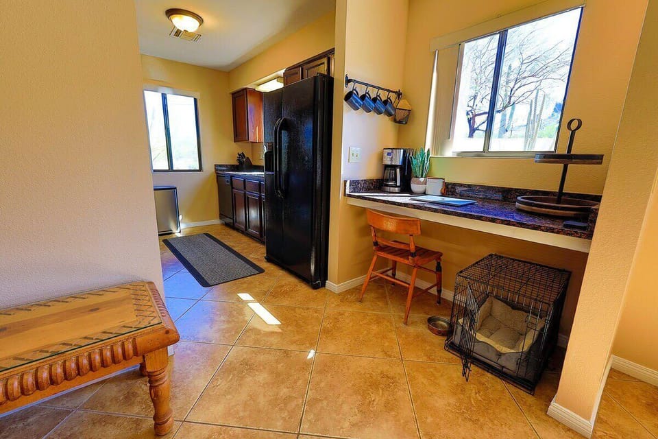 coffee bar and work space for those Zoom meetings.  Entrance to the fully-equipped kitchen.