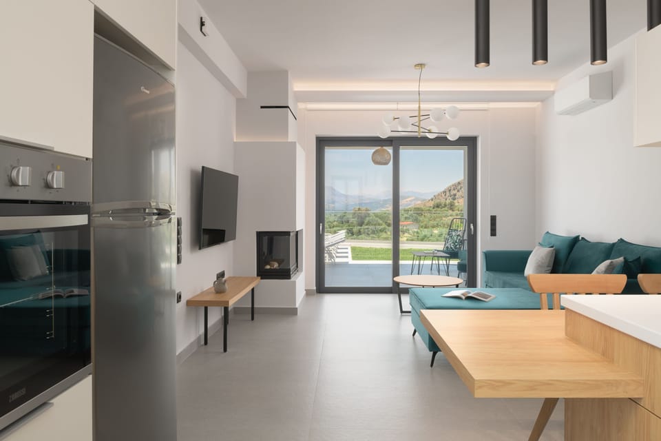 The open plan living room space with bi-fold doors. 