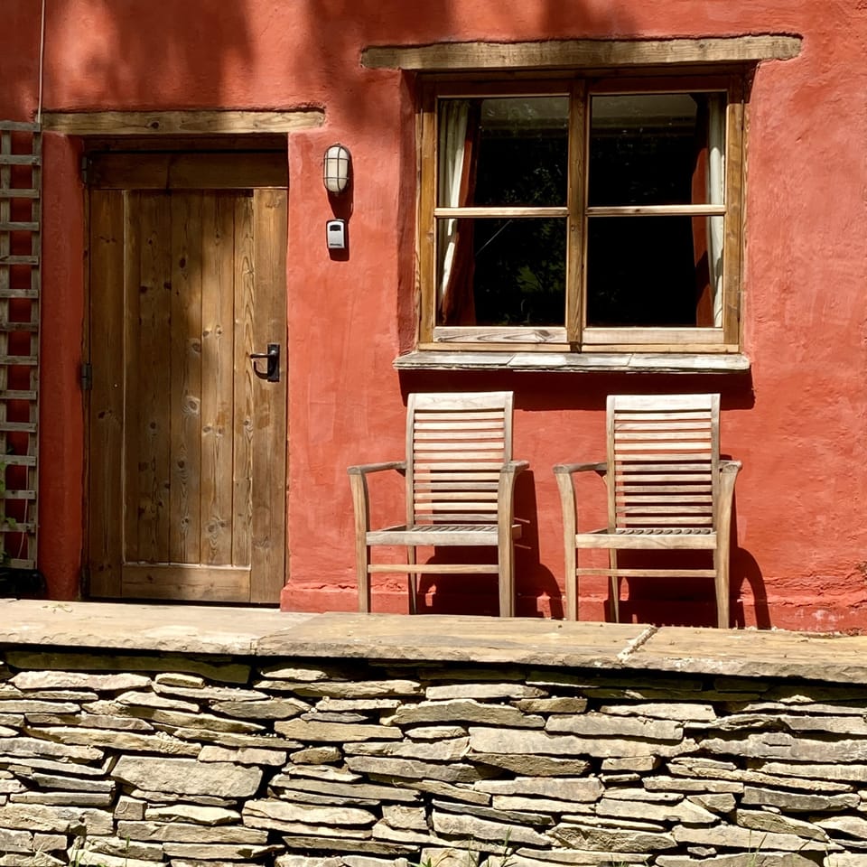 Sitting on the veranda, outside the front door