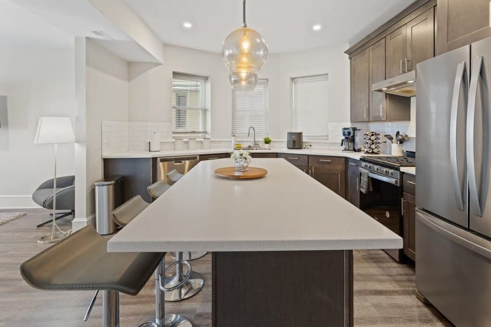 Designer kitchen with island in open concept living area