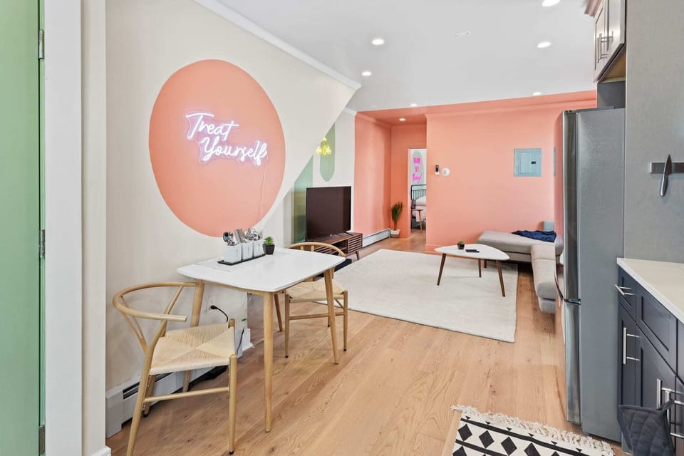 Eat together at café style dining table with cool neon lighting