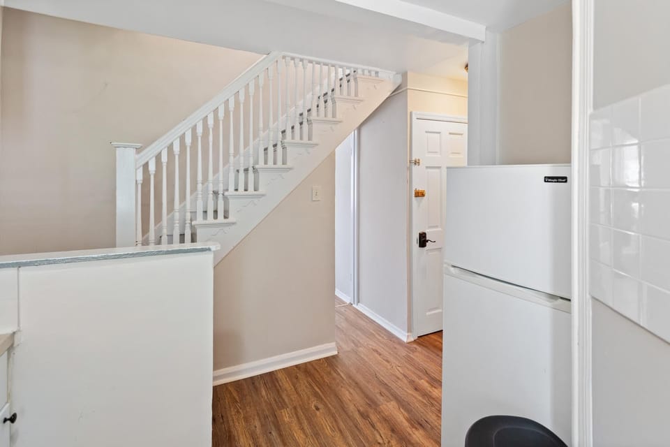 Kitchen upon entry to Apartment (w/stairs to top floor)