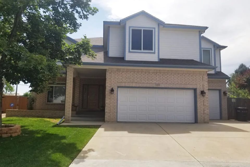 Parking in driveway up to four cars. Front door main access to home. 
