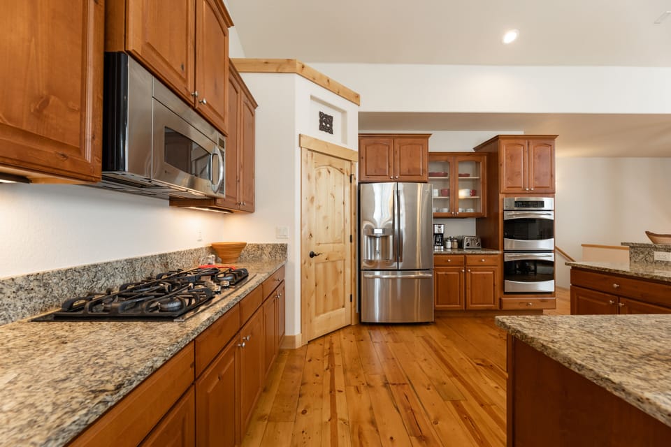 The kitchen is equipped with a double oven and new appliances