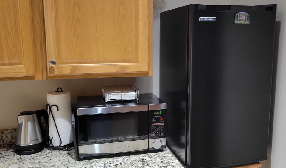Compact fridge, microwave and electric water pot are the starting essentials