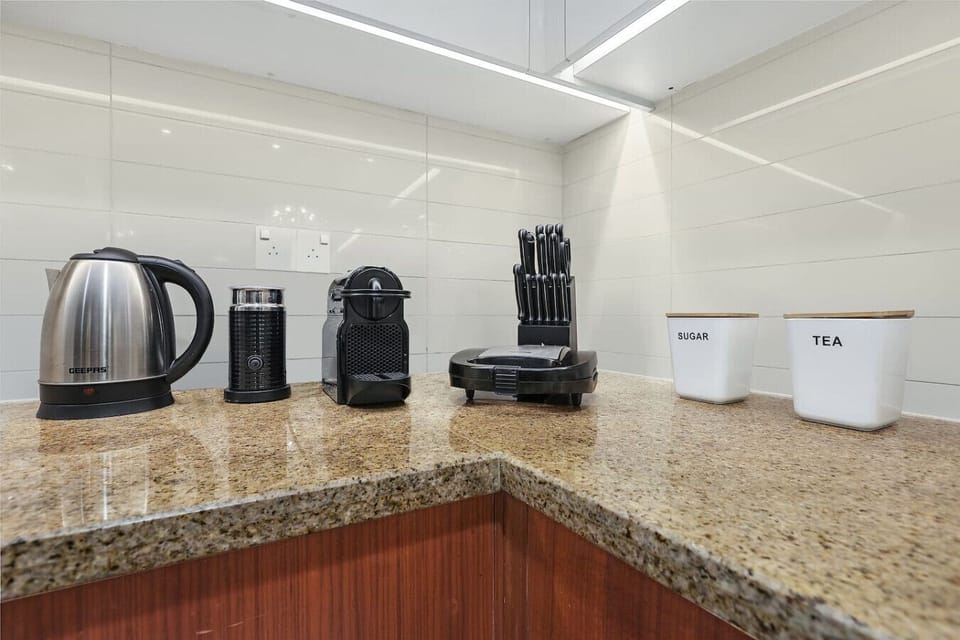 Kitchen: Prepare culinary delights with top-notch appliances and elegant granite countertops!