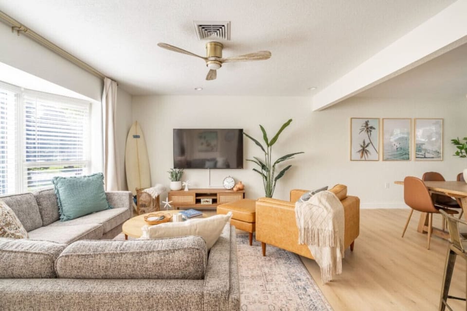 Unwind in the living room, featuring a comfortable couch and a smart TV, perfect for relaxing and enjoying your favorite shows and movies.