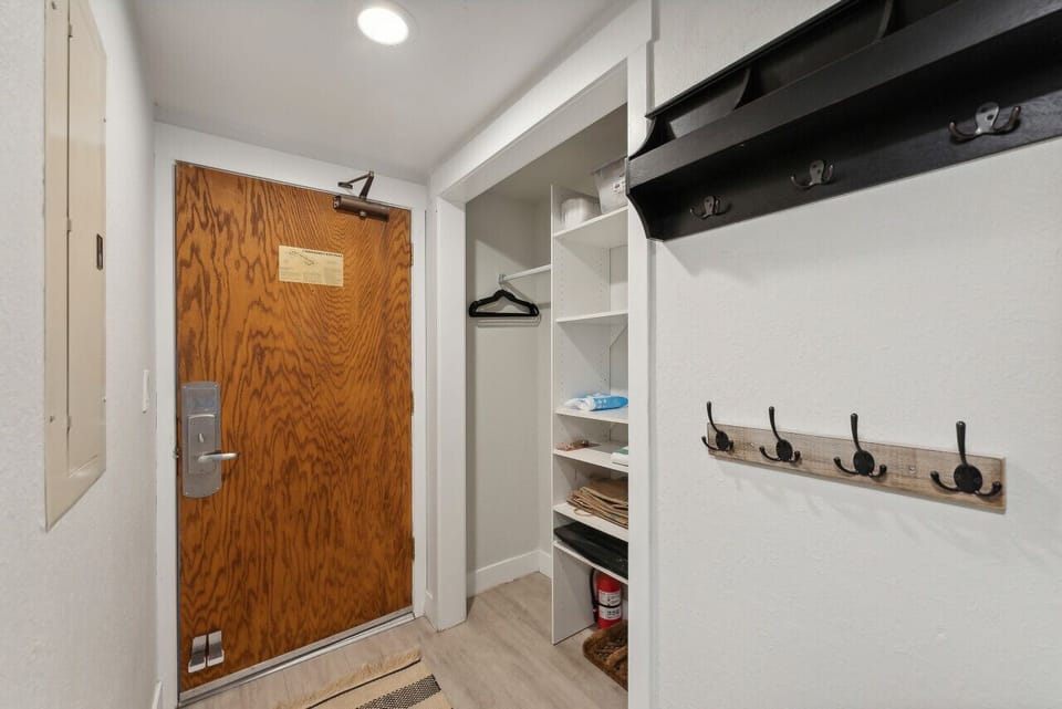 Entryway with room for skis/snowboards/coats/boots etc.