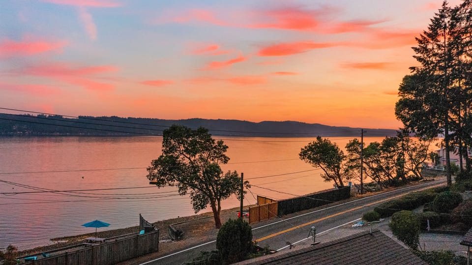 Enjoy a private, fenced-in beach with firepit, water toys, and shellfish.