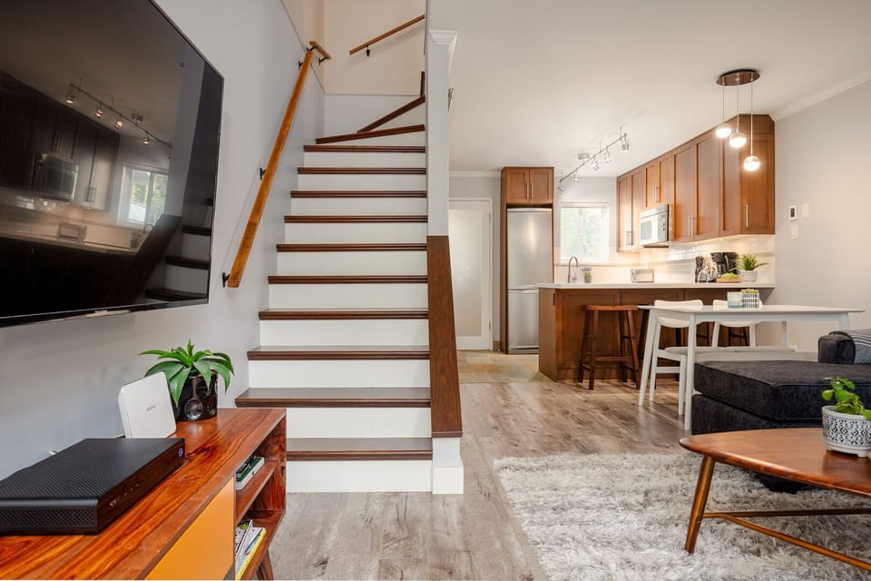 Spacious open-plan layout connecting kitchen, dining, and living areas