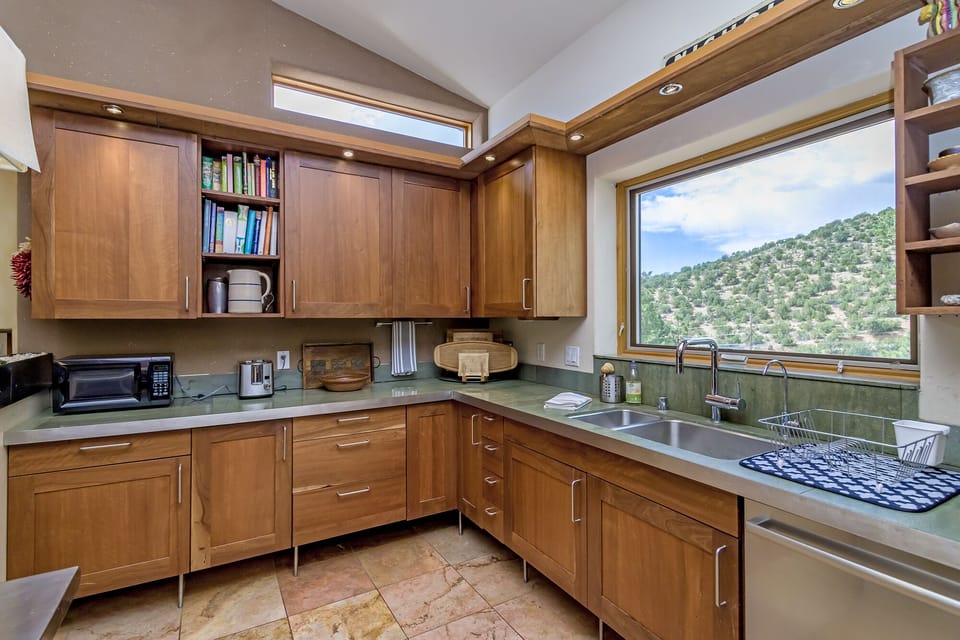Lot of kitchen cabinets provide ample storage. 